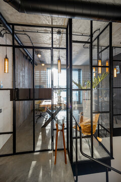 Glass partition to the home office in loft style