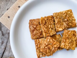 fried tempeh on a plate.