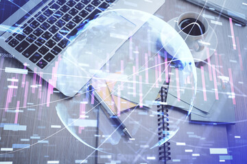 Obraz premium Stock market graph and top view computer on the table background. Double exposure. Concept of financial education.