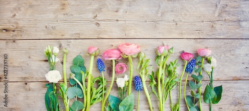spring flowers on rustic wooden background