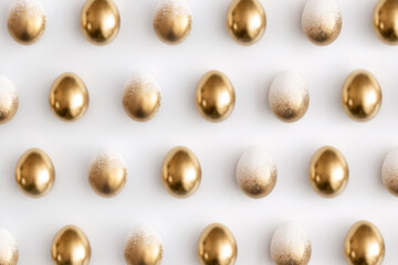 Pattern composition of golden eggs on a white background. Minimal easter concept.