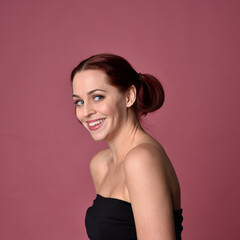 close up portrait of red haired women with different facial expressions on a pink studio background.