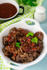 Homemade succulent meat venison stew in red wine sauce