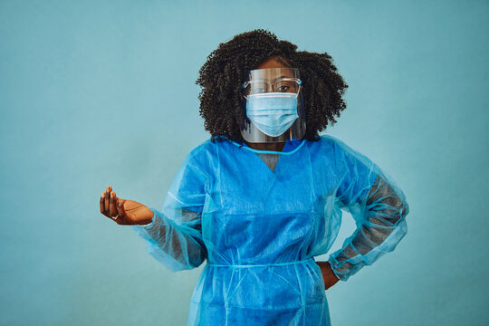 Nurse Practitioner With Personal Protective Equipment Face Shield Goggles One Hand Out Covid 19