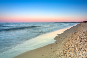 Amazing sunset at the beach of Baltic Sea in Sopot, Poland