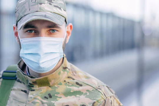 Young Male Student Wearing Protective Masks Outdoors During The Coronavirus Pandemic. Pupils Of The Military Training Center