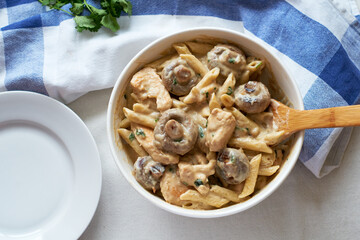 Pasta with mushrooms in a creamy sauce. Top view.