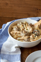 Pasta with mushrooms in a creamy sauce. Side view.