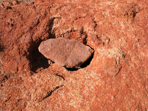 Australian Aboriginal gnamma hole, or a rock hole containing water, now covered for protection.
Outback Australia.