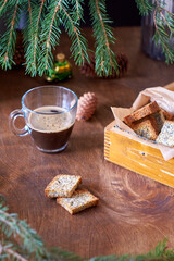 Cookies with poppy seeds. Crackers. Coffee, spruce branches, cones. Side view.