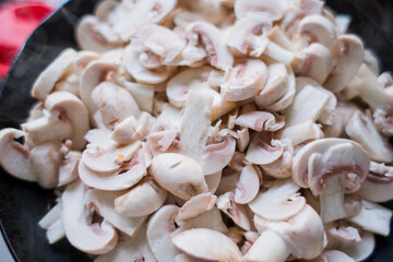 a lot of champignon mushrooms on the table