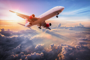 Landscape with aircraft is flying above clouds in the blue sky. Travel background with passenger...