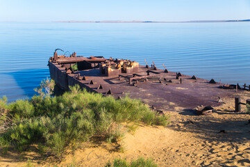 Environmental disaster in the Aral Sea, old ships in the place of the dried up sea. Central Asia, the Aral Sea.