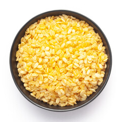 Close-Up of Crunchy Moong Dal in a black Ceramic bowl, made with roasted Mung bean. Indian spicy snacks (Namkeen), Top View