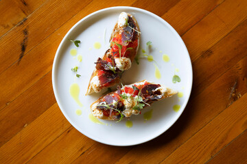 bruschetta with basturma, cottage cheese and pepper with herbs