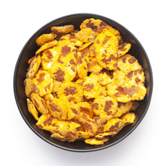 Close-up of Spicy Chana Jor Garam in a black Ceramic bowl, made with air-fried Bengal Chickpea. Pile of Indian spicy snacks (Namkeen), Top View