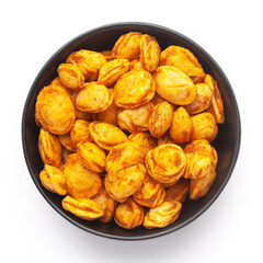 close-up of Roasted Crunchy Peanuts in a ceramic black bowl, made with peanuts. Pile of Indian spicy snacks (Namkeen), Top view