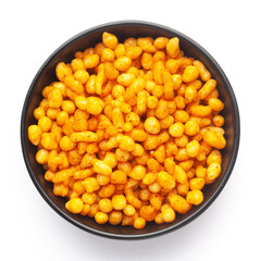 Close up of crunchy masala boondi Indian namkeen (snacks) on a ceramic black bowl. Top view