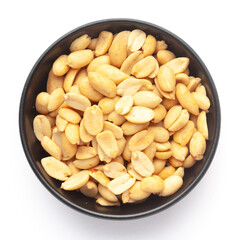 Close up of crunchy roasted Peanuts Indian namkeen (snacks) on a ceramic black bowl. Top view