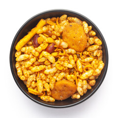 Close up of very spicy-sweet Fatafat Bhel mixture Indian namkeen (snacks) on a ceramic black bowl. Top view