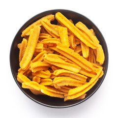 Close up of salted Soya Sticks Indian namkeen (snacks) on a ceramic black bowl. Top view