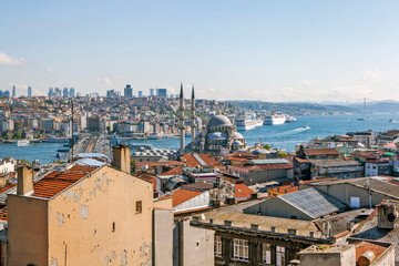 Obraz premium View of the New Mosque, the Bosphorus and the Ataturk Bridge from the roof of Buyuk Valide Sultan Khan. Istanbul. Turkey.