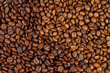 Coffee beans close up. Texture of brown coffee beans.