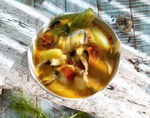 Flat lay bouillabaisse fish soup in a bowl