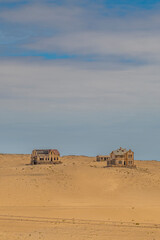 Vertical landscape over German Kolmanskop Ghost Town with the abandoned buildings in the Namib desert