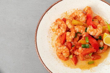 Stir fried seafood with sauce on plate with napkin