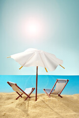 Beach umbrellas and sunbeds on the sand. Stylized cardboard beach. Paper umbrellas for cocktails in the background. The concept of rest, sea and vacation. Artificial wooden deck chairs.