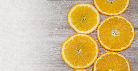 Oranges cut into circles. Oranges on a wooden background.