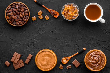 Background with assorted coffee and cocoa - beans with powder and hot drink