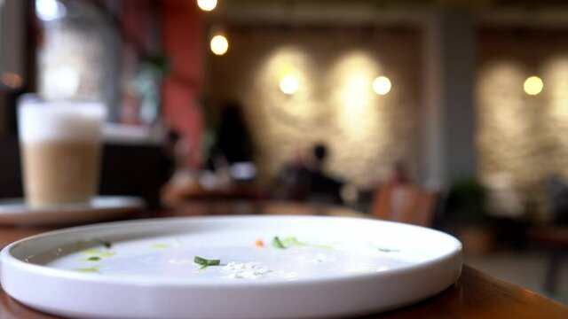 bruschetta with basturma, pepper and cottage cheese, a man takes food from a plate