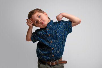 The little boy pondered and looked away