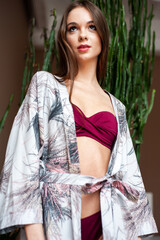 Beautiful woman in a sexy colored robe