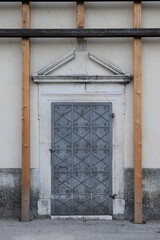 Secured Old Church Facade with Metal Door after Earthquake in Central Italy Village