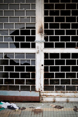 old iron door with broken window