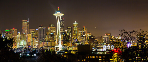 Fototapeta na wymiar Seattle city skyline at night with urban office buildings viewed from Kerry Park.