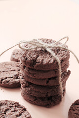 stack of tasty chocolate cookies with ribbon