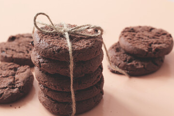stack of tasty chocolate cookies with ribbon