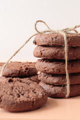 stack of tasty chocolate cookies with ribbon