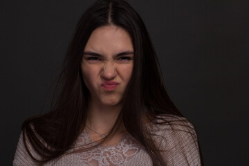 portrait of a young woman with long brown hair.