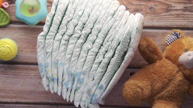stack of baby diaper on table,