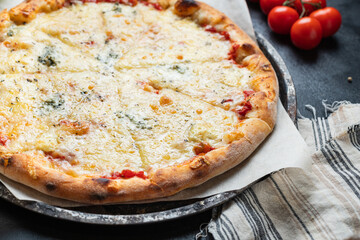 pizza cheesy 4 cheese fast food  assorted types portion on the table meal snack top view copy space food background