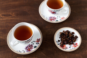 Cups with cascara beverage. Coffee cherry tea made from dried skins of coffee fruit.