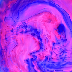 Mixing pink and blue paint in water. Ink streaks and swirls. Dynamic drawing. Abstract background