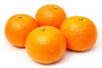 Four oranges isolated on white