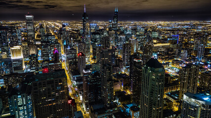 Aerial view of Chicago downtown at night from John Hancock skyscraper high above