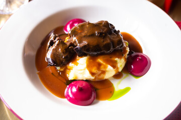 beef cheek with mashed potatoes and currant oil